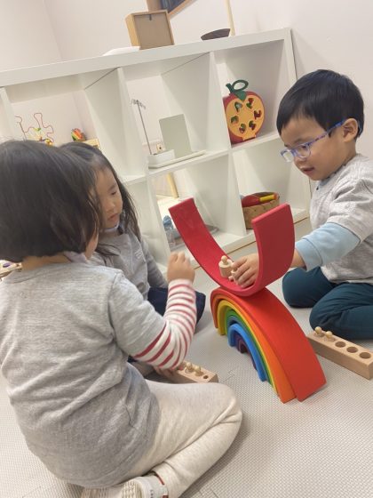 The toddlers got to experience playing with rainbow blocks.
